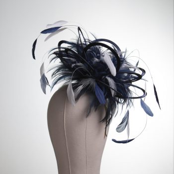 Ladies formal Navy Blue and White medium feather and satin loop fascinator hat. Suitable for a wedding or ladies day at the races