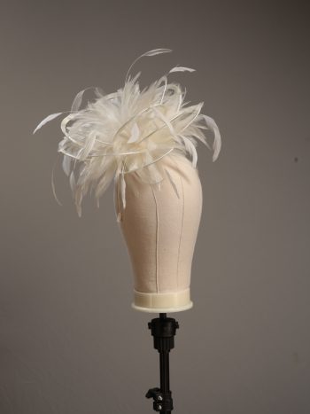 Ladies formal cream medium feather and satin loop fascinator hat. Suitable for a wedding or ladies day at the races