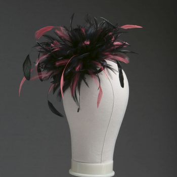 Ladies wedding or races black and coral pink small feather and satin loop fascinator hat