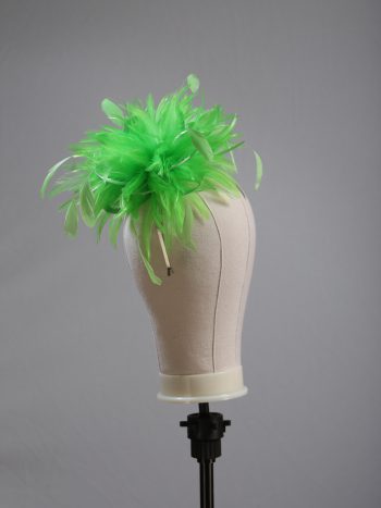 Ladies wedding or races apple lime green small feather and satin loop fascinator hat