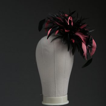 Ladies wedding or races black and coral pink small feather and satin loop fascinator hat