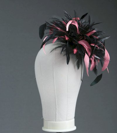 Ladies wedding or races black and coral pink small feather and satin loop fascinator hat