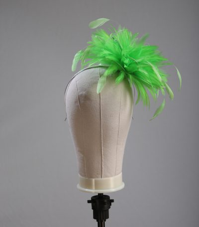 Ladies wedding or races apple lime green small feather and satin loop fascinator hat