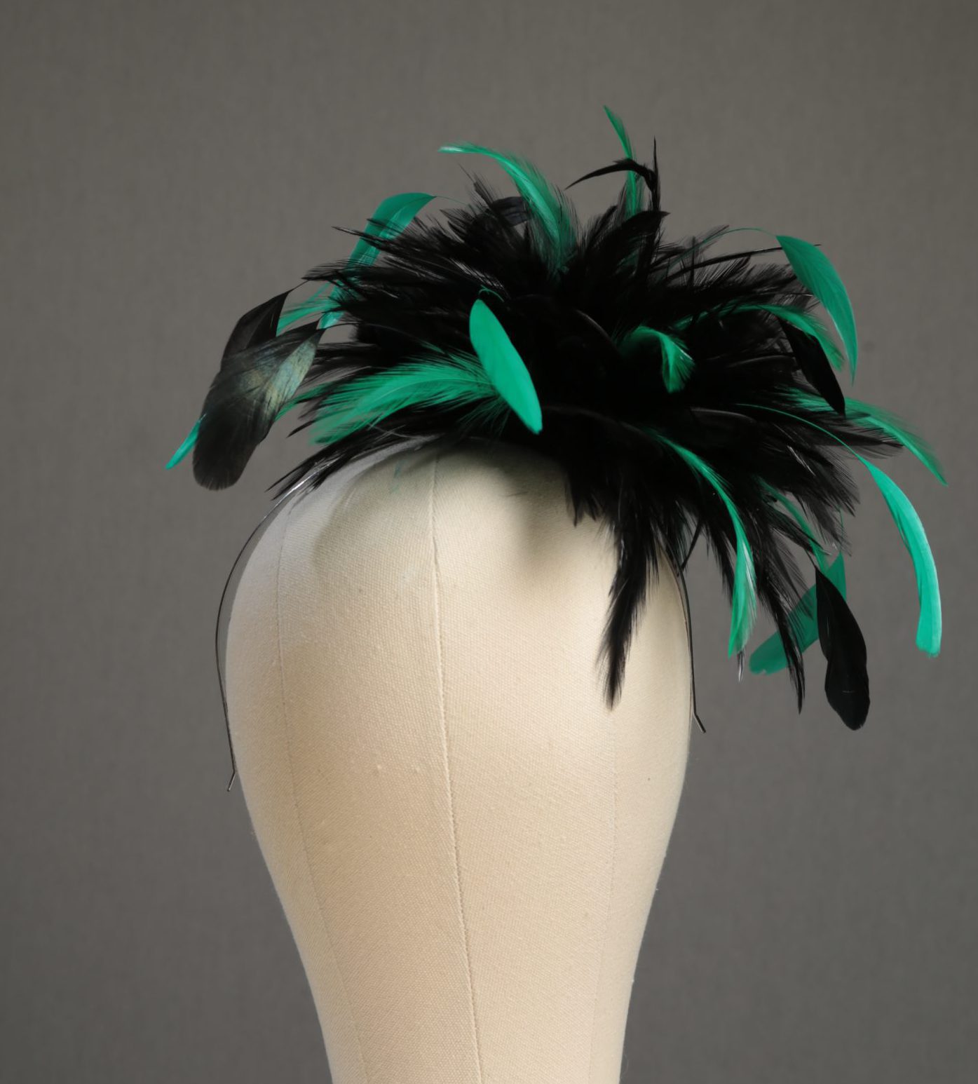 Ladies wedding or races black and emerald green small feather and satin loop fascinator hat