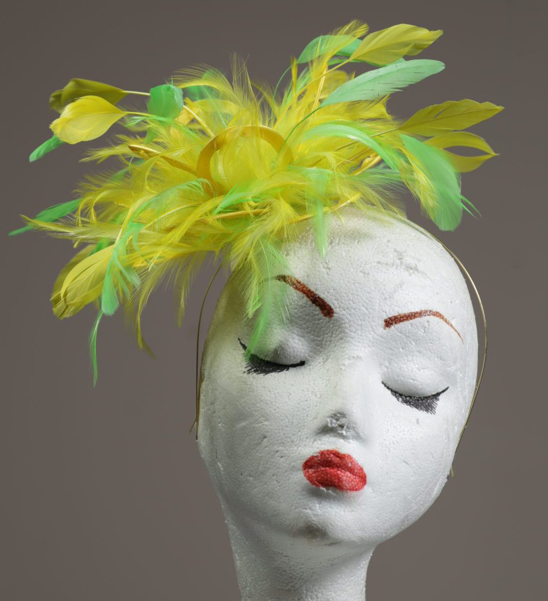 yellow and lime green small feather fascinator hat
