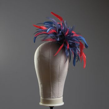 navy blue and red small hackle fascinator hat with feathers set on a headband