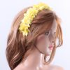 Yellow organza flower headband suitable for a ladies day at the races, bridal or a wedding