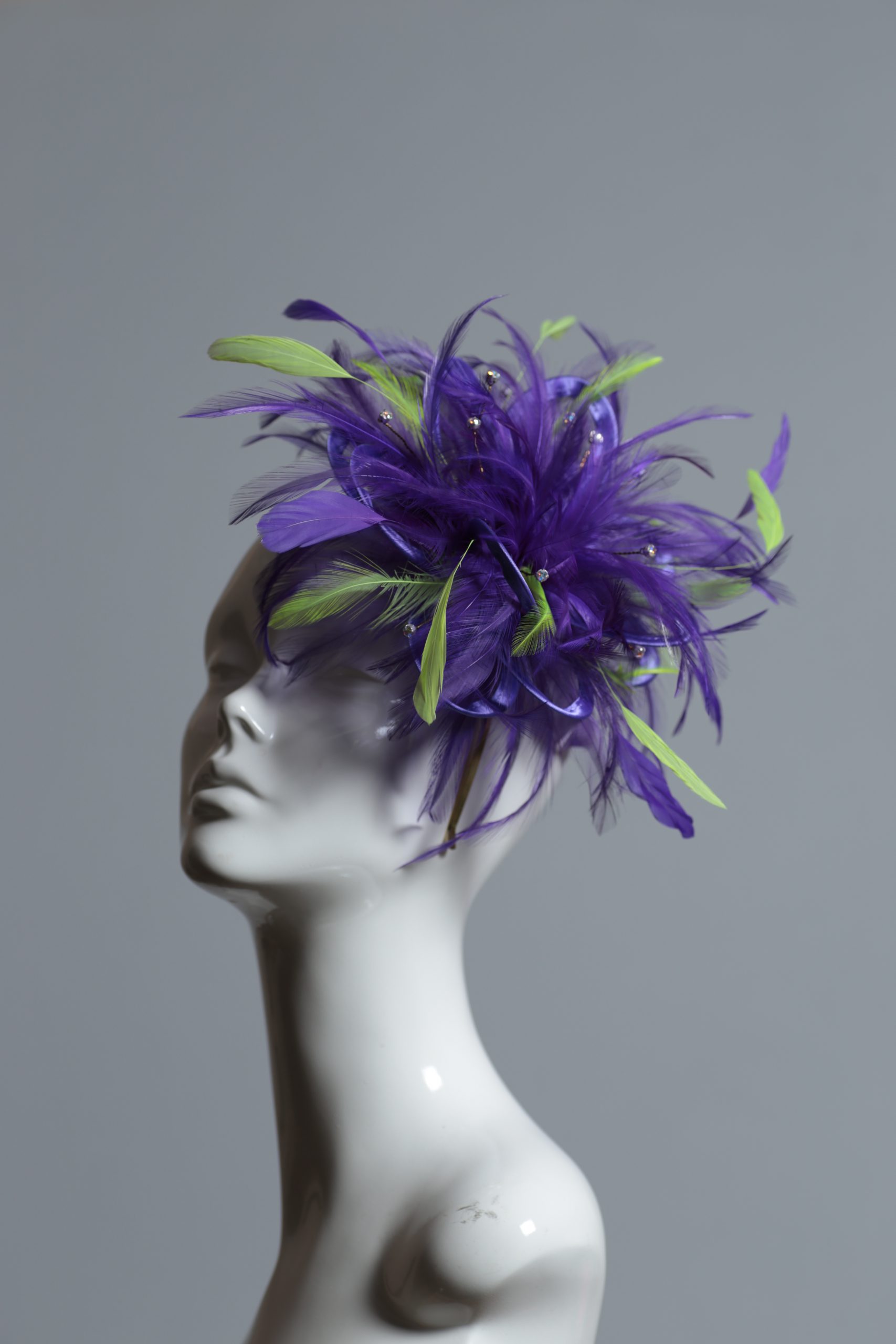 purple and acid lime green small feather fascinator hat