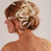 Cream small sinamay and feather fascinator hat