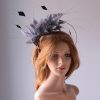 pewter grey feather mount on a black halo crown headband