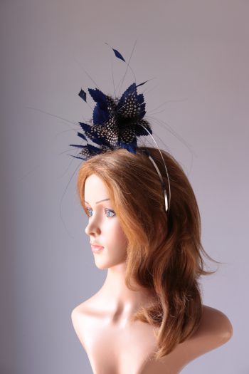 royal blue and black feather mount on a silver halo crown