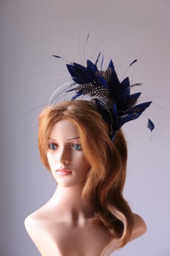 royal blue and black feather mount on a silver halo crown