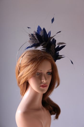 royal blue and black feather mount on a silver halo crown