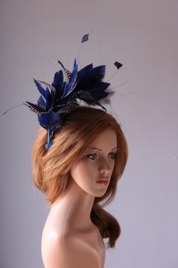 royal blue and black feather mount on a silver halo crown