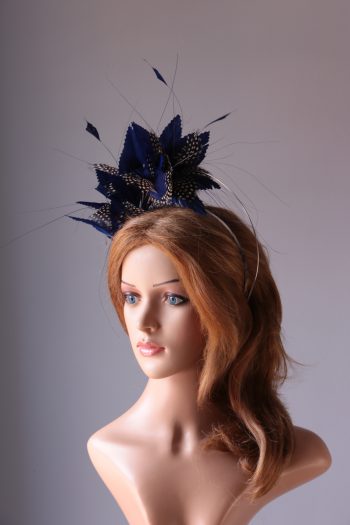 royal blue and black feather mount on a silver halo crown