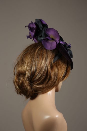 Aubergine sinamay saucer fascinator hatinator hat with purple and black orchid flowers