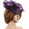 Aubergine sinamay saucer fascinator hatinator hat with purple and black orchid flowers