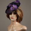 Aubergine sinamay saucer fascinator hatinator hat with purple and black orchid flowers