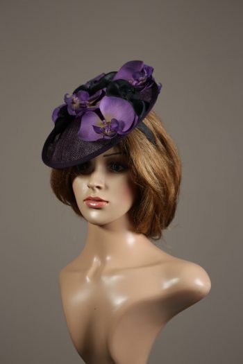 Aubergine sinamay saucer fascinator hatinator hat with purple and black orchid flowers