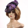 Aubergine sinamay saucer fascinator hatinator hat with purple and black orchid flowers