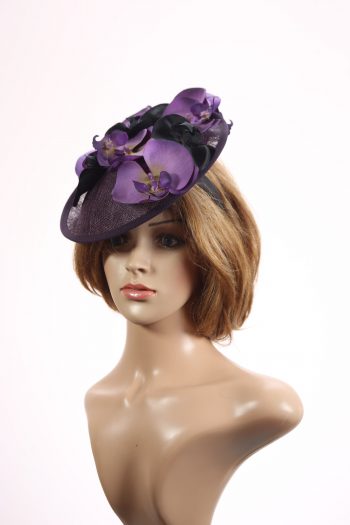 Aubergine sinamay saucer fascinator hatinator hat with purple and black orchid flowers