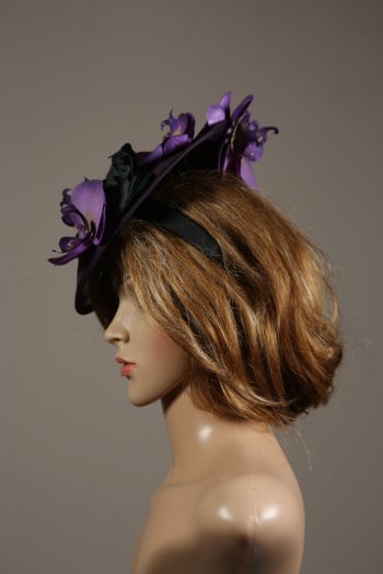 Aubergine sinamay saucer fascinator hatinator hat with purple and black orchid flowers