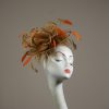 Gold satin Loop Fascinator Hat with gold and orange feathers