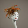 Gold satin Loop Fascinator Hat with gold and orange feathers