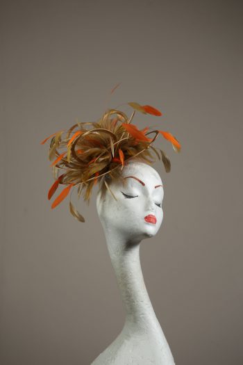 Gold satin Loop Fascinator Hat with gold and orange feathers