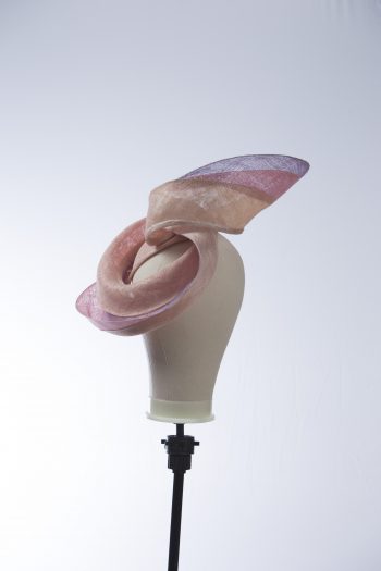 Pink lilac and oyster sinamay swirl fascinator hat set on a teardrop base