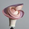 Pink lilac and oyster sinamay swirl fascinator hat set on a teardrop base