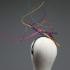 Rainbow multi-coloured quill floating fascinator hat set on a headband