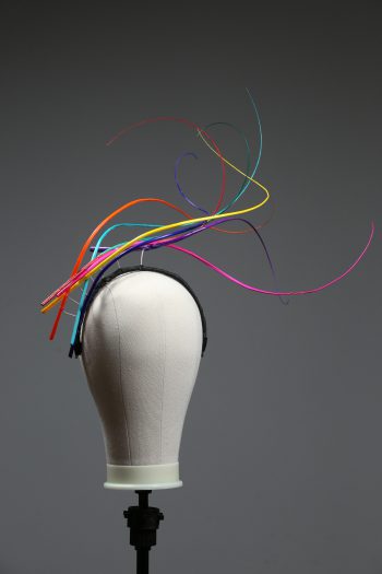 Rainbow multi-coloured quill floating fascinator hat set on a headband