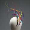 Rainbow multi-coloured quill floating fascinator hat set on a headband