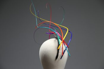 Rainbow multi-coloured quill floating fascinator hat set on a headband