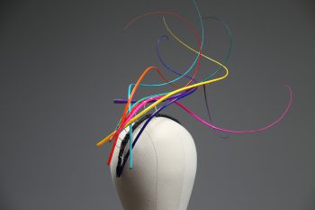 Rainbow multi-coloured quill floating fascinator hat set on a headband