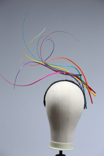 Rainbow multi-coloured quill floating fascinator hat set on a headband