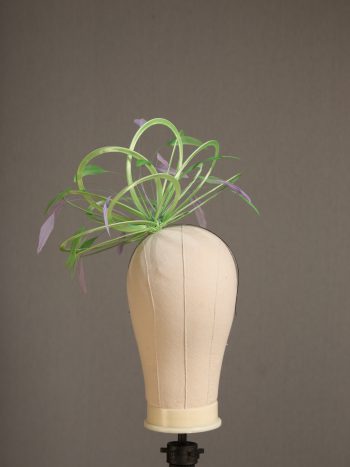 Ladies' formal Apple lime green and Lilac medium feather and satin loop fascinator hat. Suitable for a wedding or ladies' day at the races