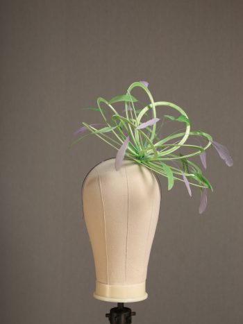 Ladies' formal Apple lime green and Lilac medium feather and satin loop fascinator hat. Suitable for a wedding or ladies' day at the races