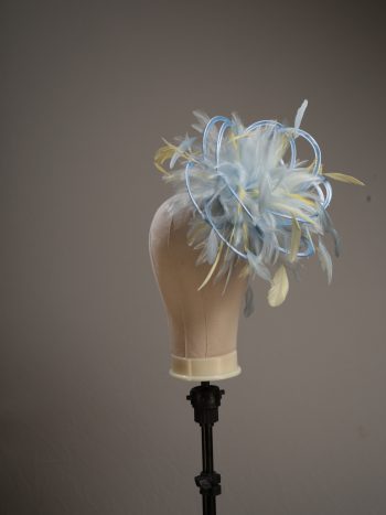 Ladies formal Baby blue and yellow medium feather and satin loop fascinator hat. Suitable for a wedding or ladies day at the races