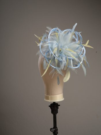 Ladies formal Baby blue and yellow medium feather and satin loop fascinator hat. Suitable for a wedding or ladies day at the races