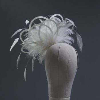 Ladies formal Ivory medium feather and satin loop fascinator hat. Suitable for a wedding or ladies day at the races