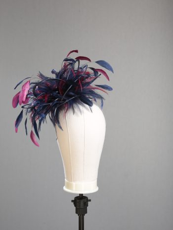 Ladies' formal Navy Blue and Burgundy Wine medium feather and satin loop fascinator hat. Suitable for a wedding or ladies' day at the races