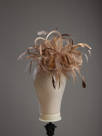 Ladies' formal Taupe Nude and Gold medium feather and satin loop fascinator hat. Suitable for a wedding or ladies' day at the races