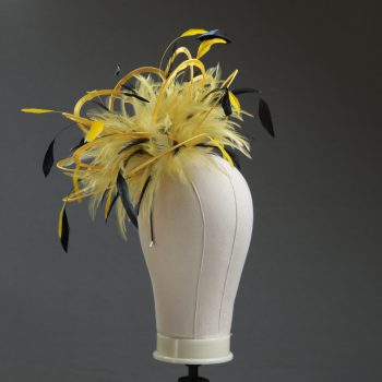 Ladies formal yellow and black medium feather and satin loop fascinator hat. Suitable for a wedding or ladies day at the races