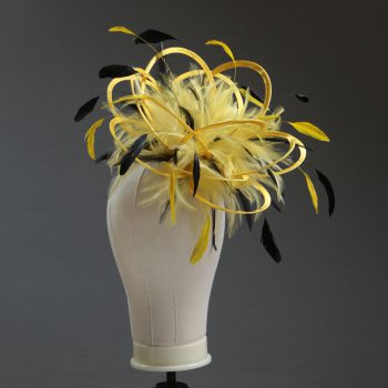 Ladies formal yellow and black medium feather and satin loop fascinator hat. Suitable for a wedding or ladies day at the races