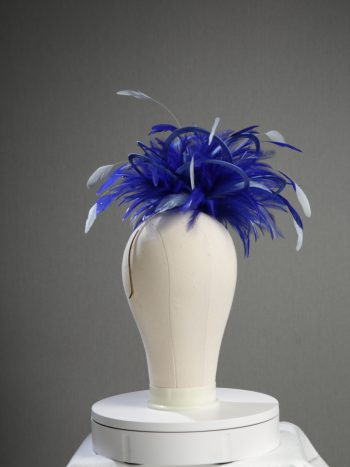 Ladies' formal royal blue and baby blue medium feather and satin loop fascinator hat. Suitable for a wedding or ladies' day at the races