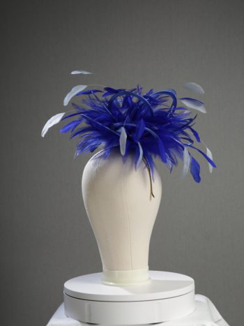 Ladies' formal royal blue and baby blue medium feather and satin loop fascinator hat. Suitable for a wedding or ladies' day at the races