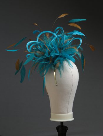 Ladies' formal Turquoise and Gold medium feather and satin loop fascinator hat. Suitable for a wedding or ladies' day at the races