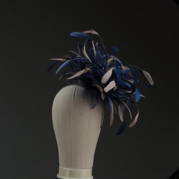 Ladies' formal Navy Blue and Taupe Nude medium feather and satin loop fascinator hat. Suitable for a wedding or ladies' day at the races